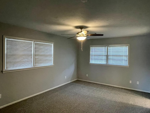 unfurnished room featuring carpet floors and ceiling fan