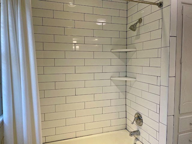 bathroom with shower / bath combination with curtain