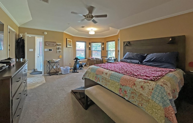 carpeted bedroom with ornamental molding and ceiling fan
