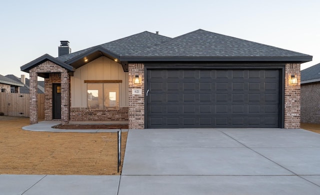 view of front of property with a garage