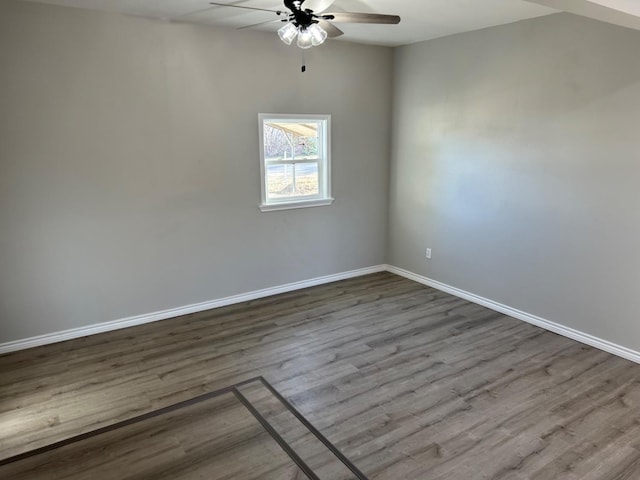 spare room with wood-type flooring and ceiling fan