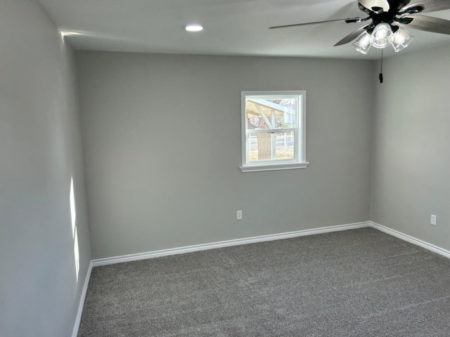 spare room with ceiling fan and carpet flooring