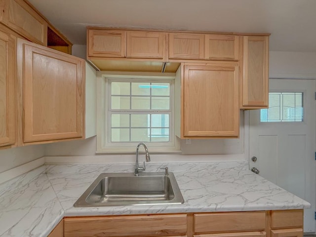 kitchen featuring sink, plenty of natural light, and light brown cabinets