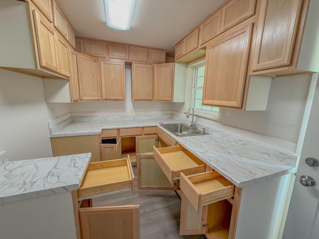 kitchen featuring light hardwood / wood-style floors, sink, and light brown cabinets