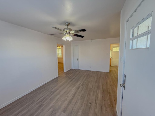 unfurnished room featuring ceiling fan and light hardwood / wood-style flooring