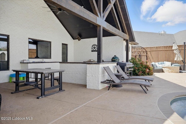 9105 Kewanee Ave, Lubbock, TX 79424 - view of patio / terrace featuring an outdoor living space and grilling area