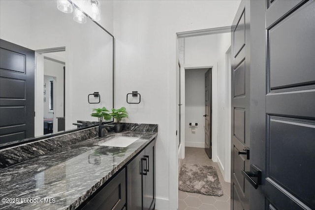 9105 Kewanee Ave, Lubbock, TX 79424 - bathroom featuring vanity and tile patterned floors