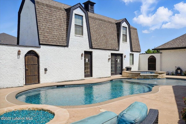 9105 Kewanee Ave, Lubbock, TX 79424 - view of swimming pool featuring french doors, a patio, and a pool with connected hot tub