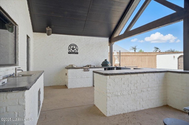 9105 Kewanee Ave, Lubbock, TX 79424 - view of patio / terrace featuring exterior kitchen and a sink