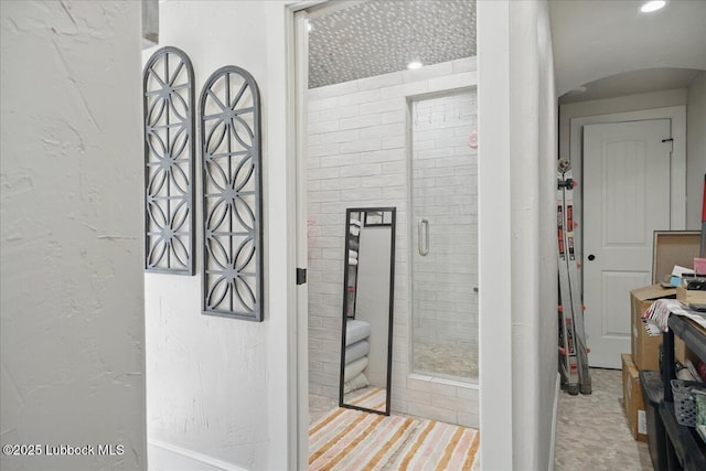 9105 Kewanee Ave, Lubbock, TX 79424 - hall with arched walkways and a textured wall