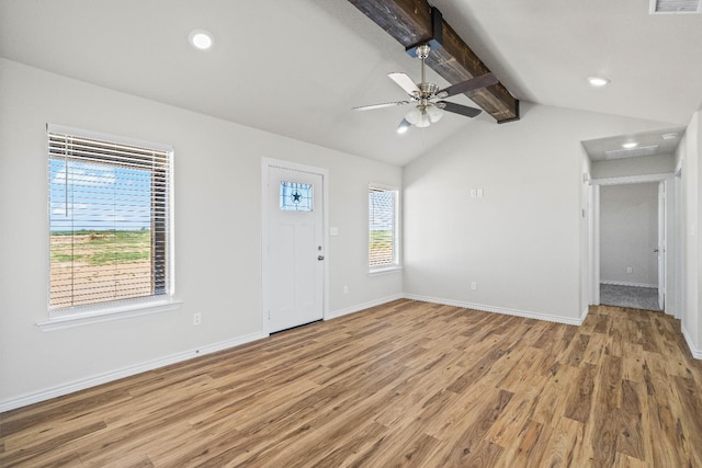 interior space with lofted ceiling with beams, hardwood / wood-style flooring, and ceiling fan