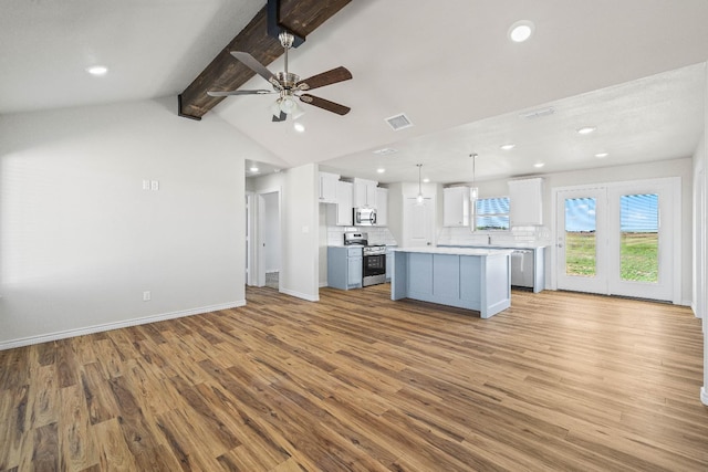 kitchen with white cabinetry, a center island, hanging light fixtures, light hardwood / wood-style flooring, and appliances with stainless steel finishes