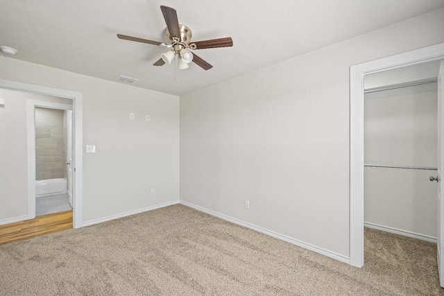 unfurnished bedroom featuring a closet, ceiling fan, and carpet