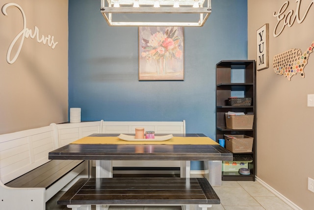 dining area with light tile patterned flooring