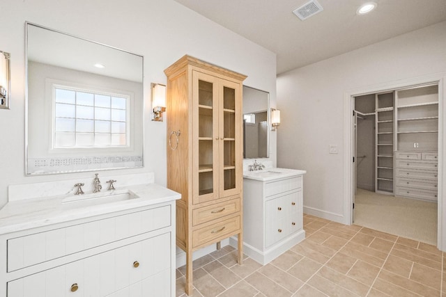 bathroom featuring tile patterned floors and vanity