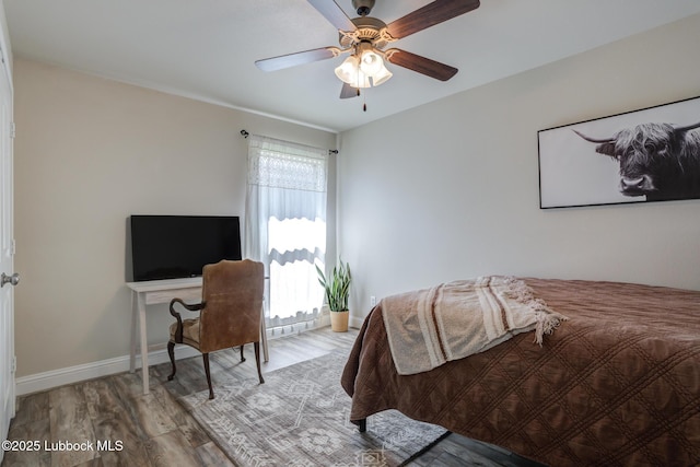 7204 90th St, Lubbock, TX 79424 - bedroom featuring wood finished floors, baseboards, and a ceiling fan