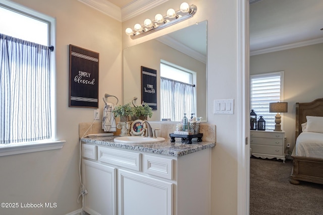 7204 90th St, Lubbock, TX 79424 - ensuite bathroom featuring vanity, crown molding, and baseboards