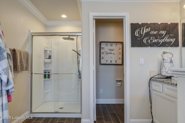 7204 90th St, Lubbock, TX 79424 - full bath featuring crown molding, wood tiled floors, baseboards, a shower stall, and recessed lighting
