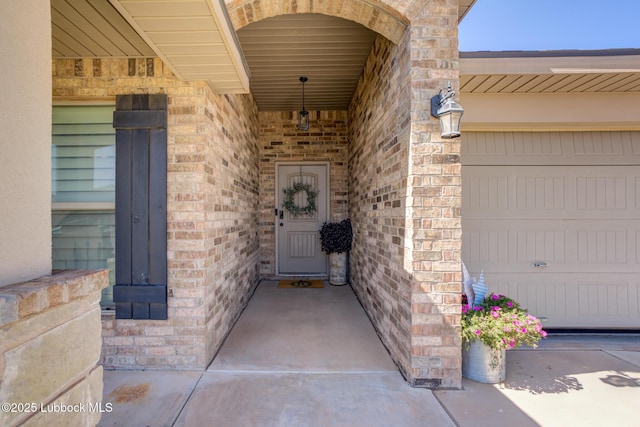 7204 90th St, Lubbock, TX 79424 - doorway to property featuring brick siding