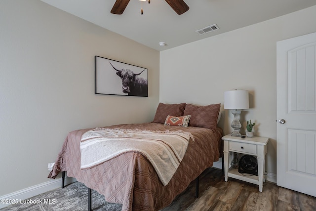7204 90th St, Lubbock, TX 79424 - bedroom with baseboards, wood finished floors, and ceiling fan