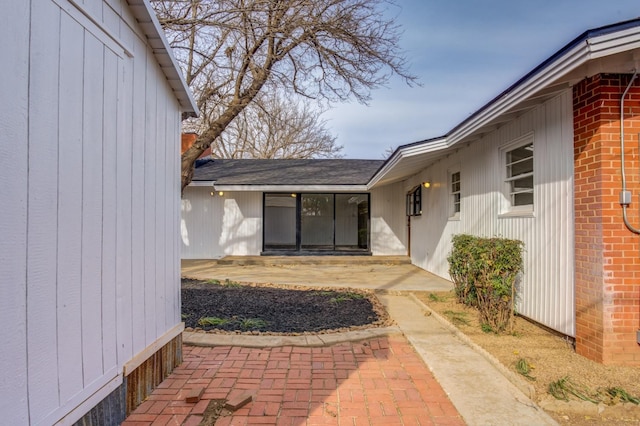 doorway to property with a patio area