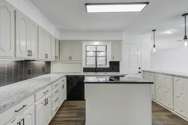 kitchen featuring white cabinetry, hanging light fixtures, dishwasher, and a kitchen island