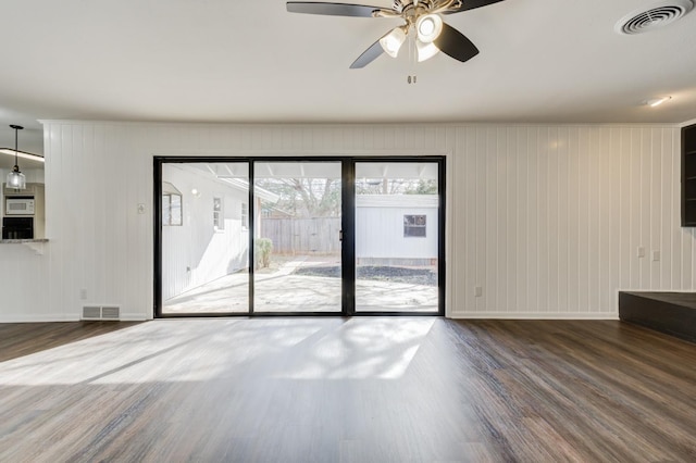 unfurnished room with hardwood / wood-style flooring and ceiling fan