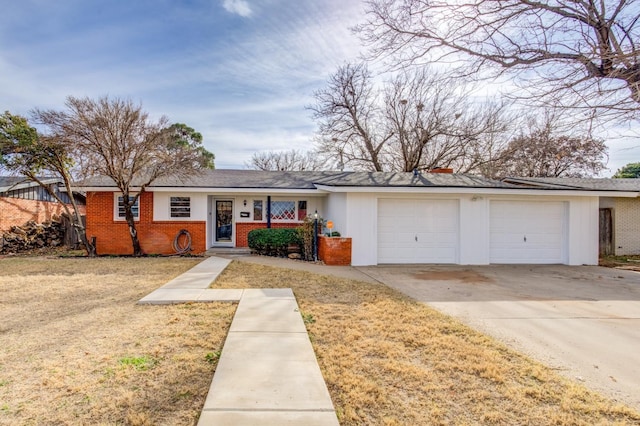 ranch-style home with a garage and a front yard