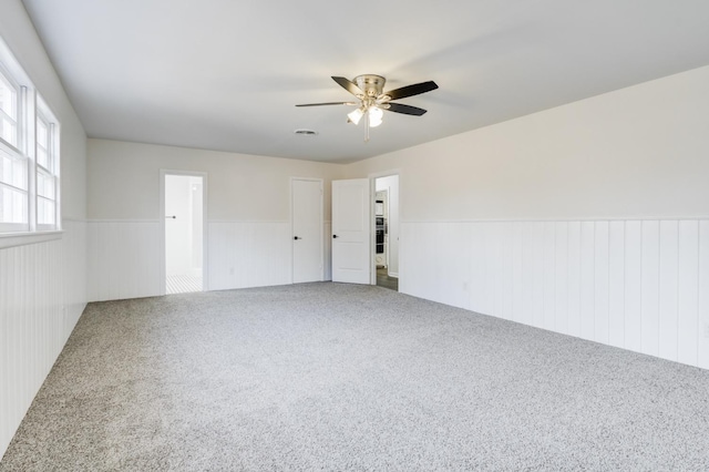 carpeted empty room with ceiling fan