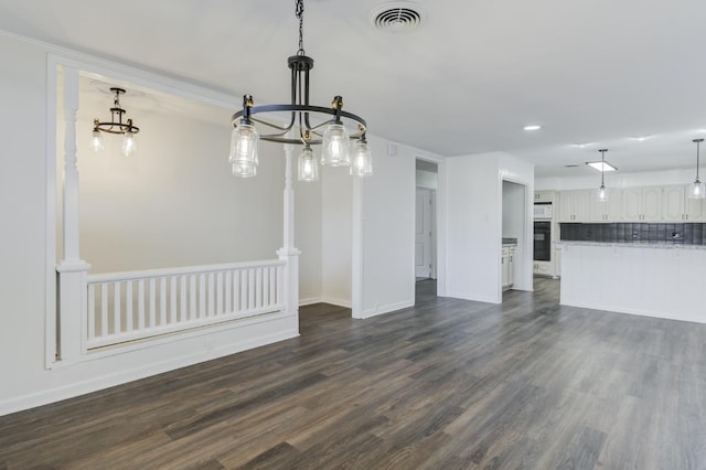 unfurnished living room featuring dark hardwood / wood-style flooring