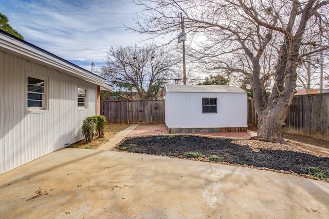 view of patio with a storage unit