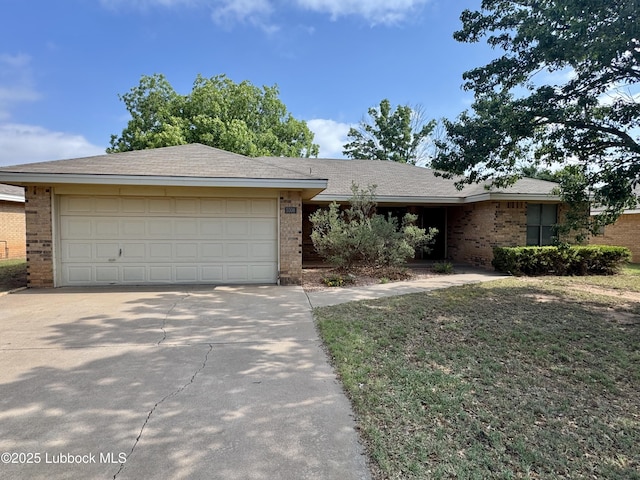 5508 94th St, Lubbock, TX 79424 - ranch-style home with brick siding, driveway, and an attached garage