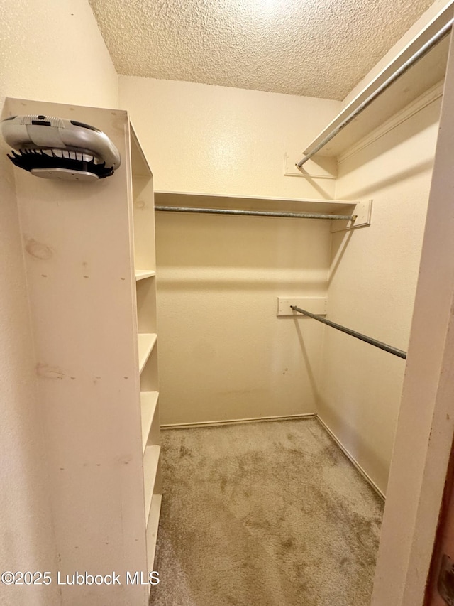 5508 94th St, Lubbock, TX 79424 - walk in closet featuring carpet