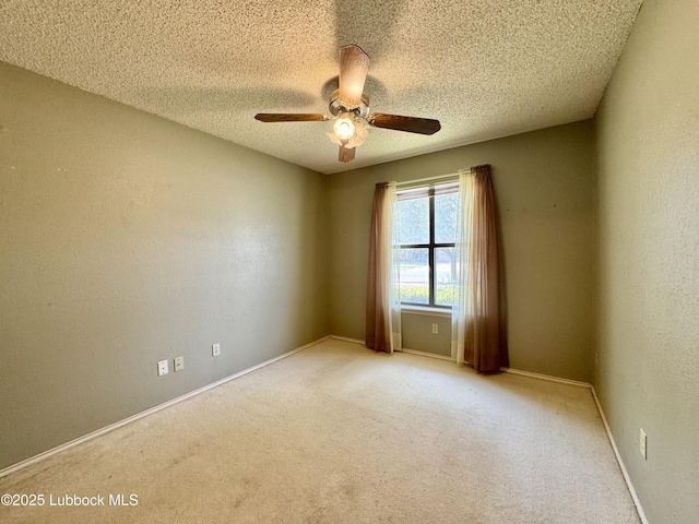 5508 94th St, Lubbock, TX 79424 - spare room with ceiling fan, light colored carpet, a textured ceiling, and baseboards