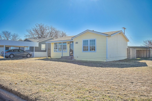 single story home with a carport