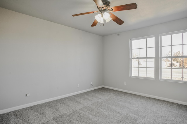 empty room featuring ceiling fan and carpet flooring