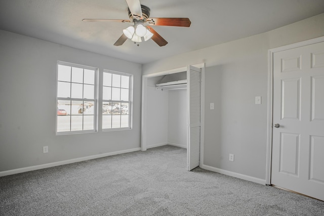 unfurnished bedroom with light carpet, ceiling fan, and a closet