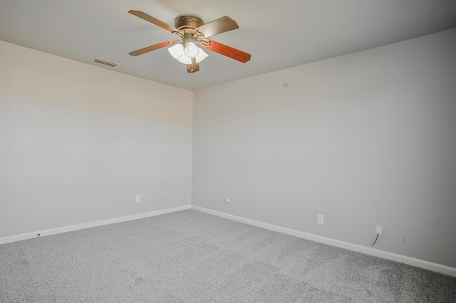 spare room featuring ceiling fan and carpet flooring