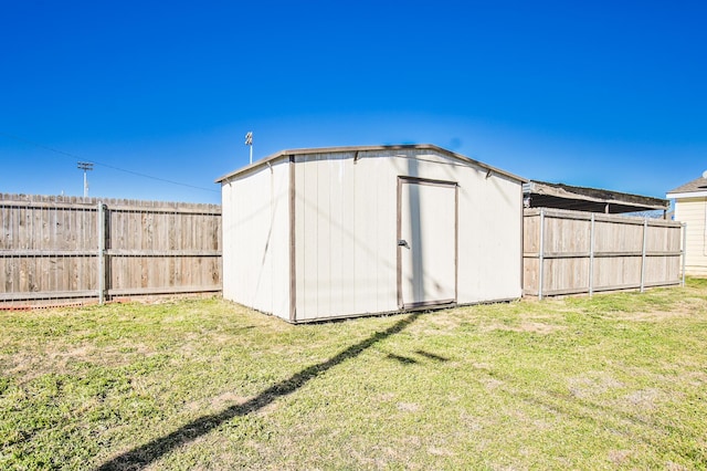 view of outdoor structure with a lawn