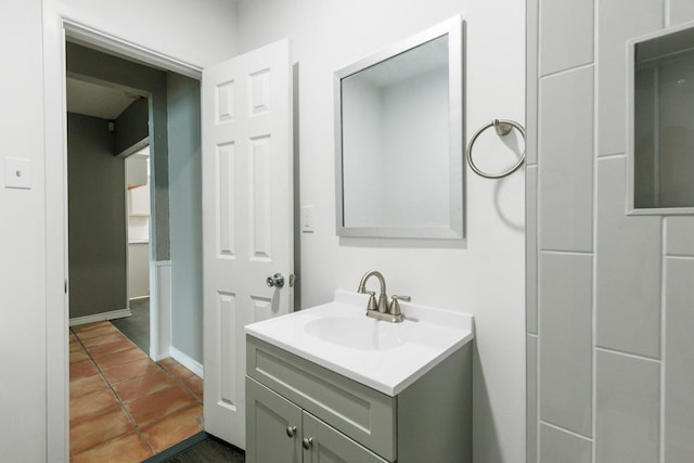 bathroom featuring tile patterned flooring and vanity