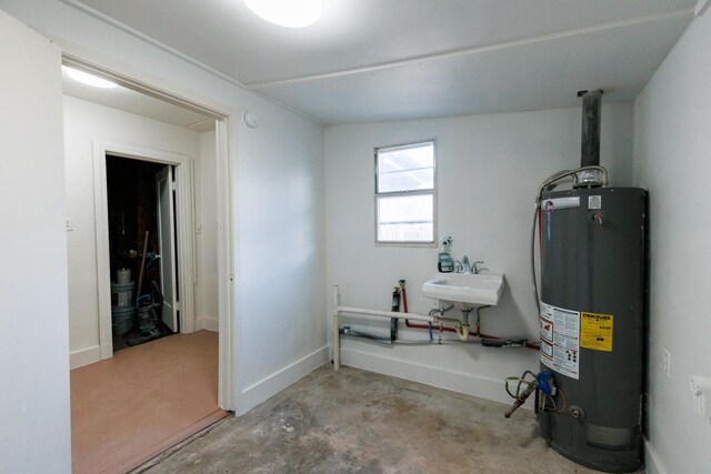 utilities with sink and gas water heater