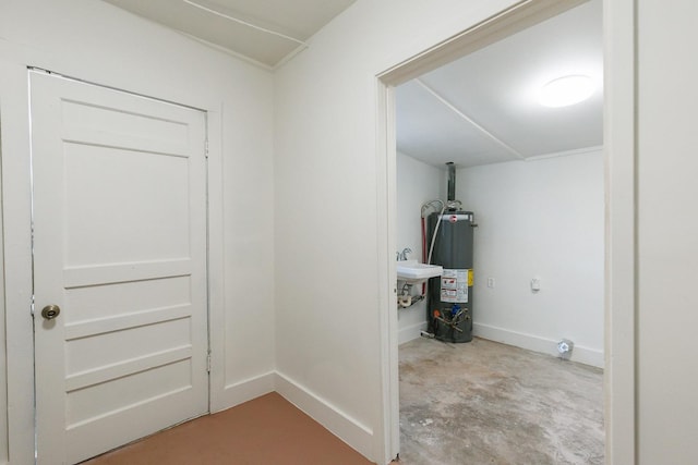 laundry area with sink and gas water heater