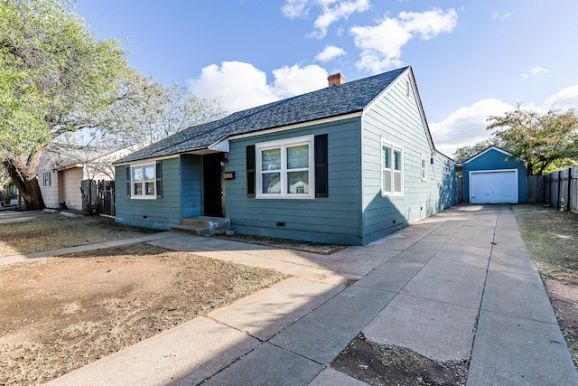 view of front of property featuring an outbuilding and a garage