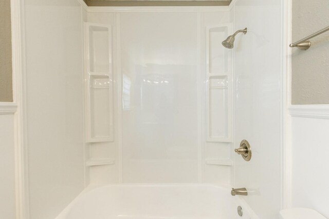 bathroom with shower / bath combination