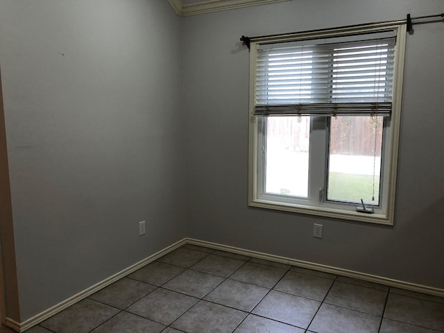 spare room featuring light tile patterned floors