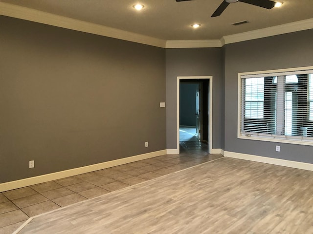 empty room with crown molding, hardwood / wood-style floors, and ceiling fan