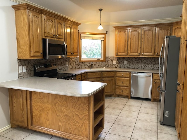 kitchen featuring appliances with stainless steel finishes, decorative light fixtures, tasteful backsplash, light tile patterned floors, and kitchen peninsula