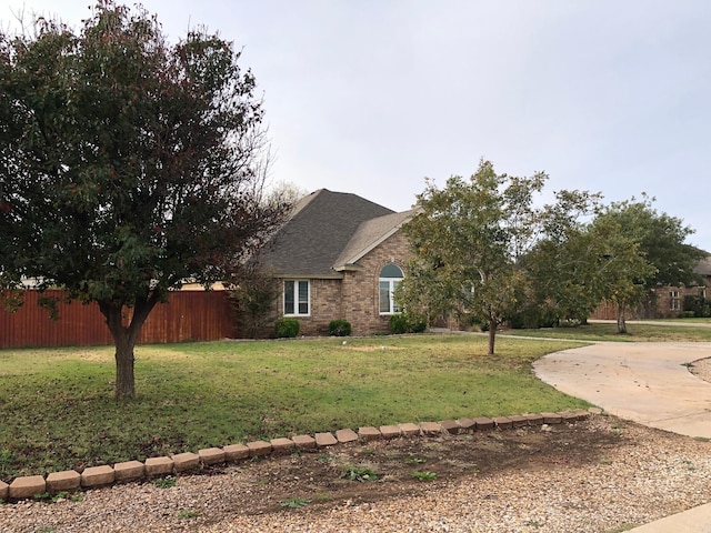 view of side of home featuring a lawn