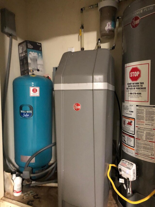 utility room featuring water heater