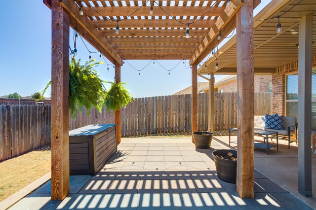 9207 Trenton Ave, Lubbock, TX 79424 - fenced backyard with a pergola and a patio